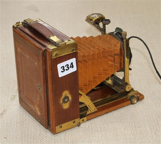 A Compur Tropical cased camera with Dialytar lens and gilt brass mounted teak case, height 18cm, depth when closed 6cm, length when